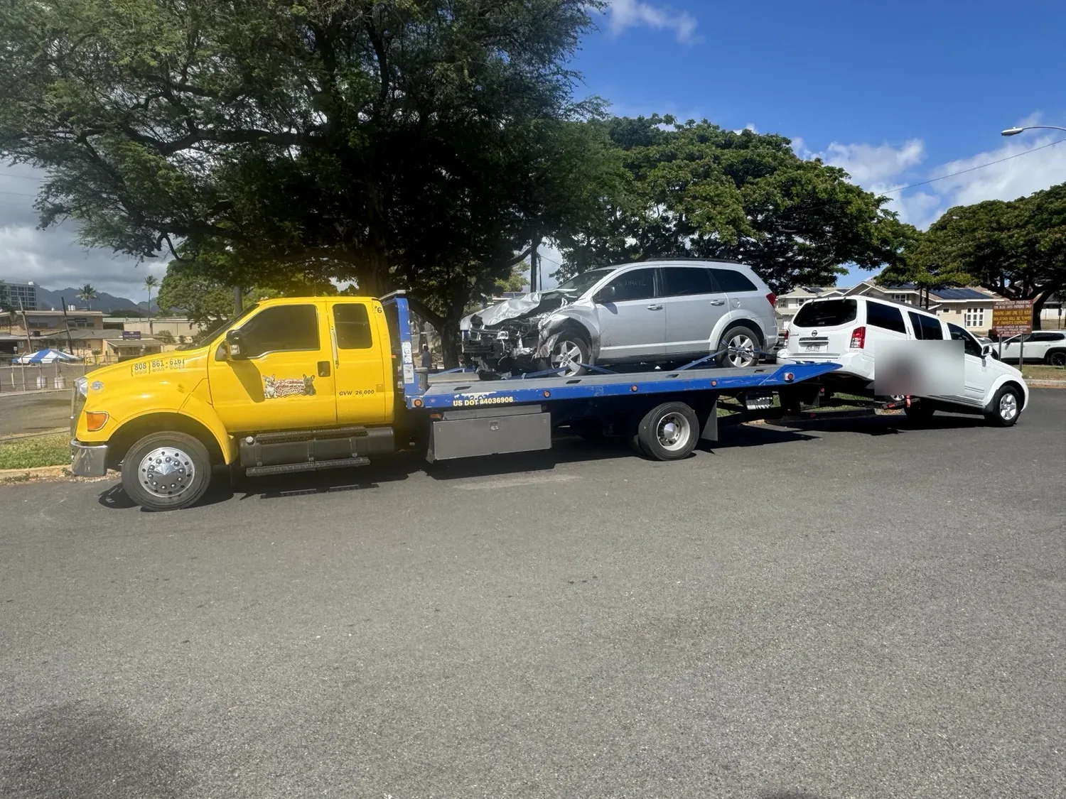 APM Towing transporting a damaged vehicle during recovery work