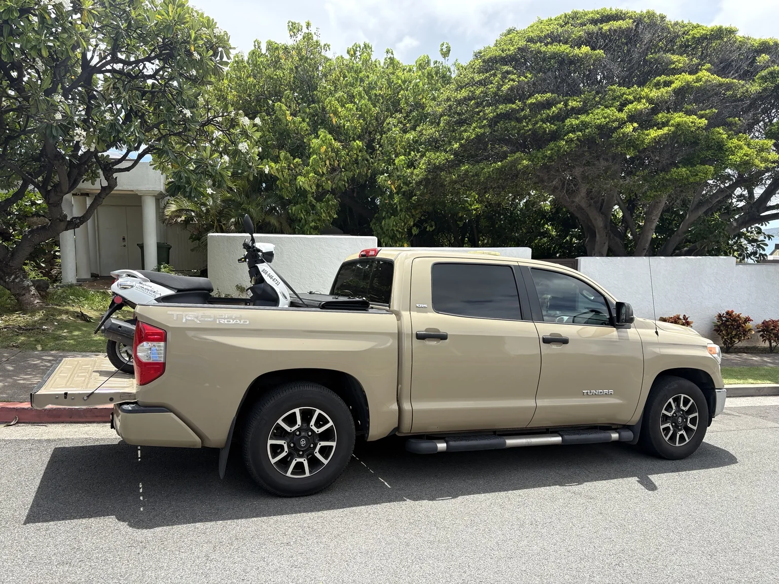 Moped secured for transport by APM Towing